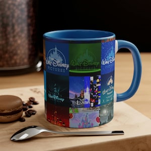 May include: A blue ceramic coffee mug with a collage of different Walt Disney Pictures logos. The logos feature the iconic Disney castle and the words "Walt Disney Pictures".
