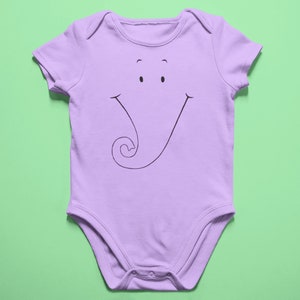 May include: A purple baby onesie with a black and white cartoon elephant face printed on the front.