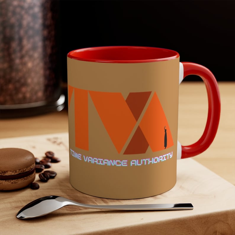 May include: A brown ceramic coffee mug with a red rim and handle. The mug features a stylized orange and brown logo that reads "Time Variance Authority".