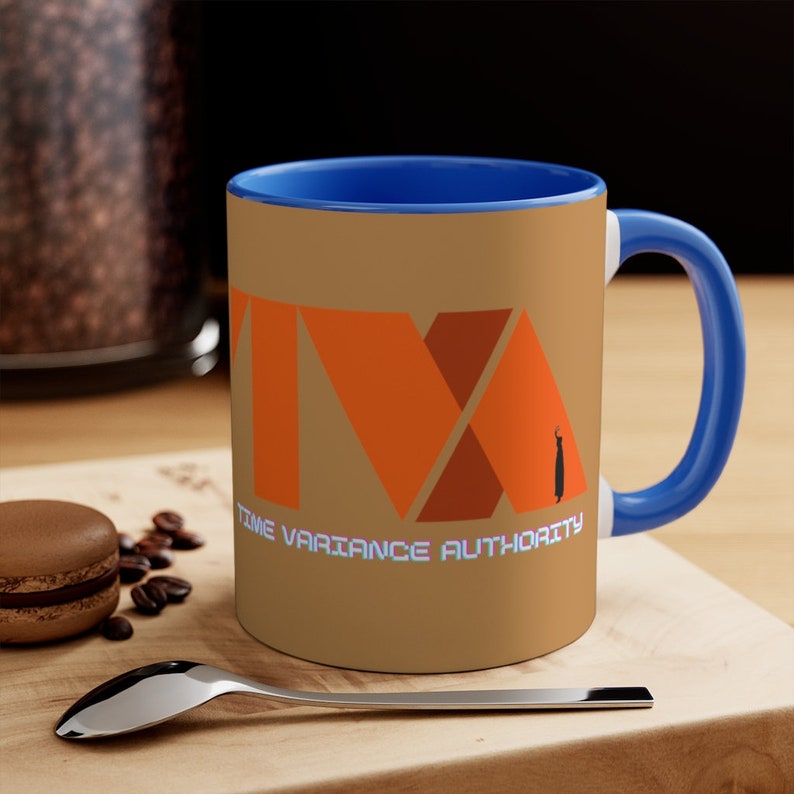 May include: A brown ceramic coffee mug with a blue rim and handle. The mug features a stylized orange logo with the text "TIME VARIANCE AUTHORITY".