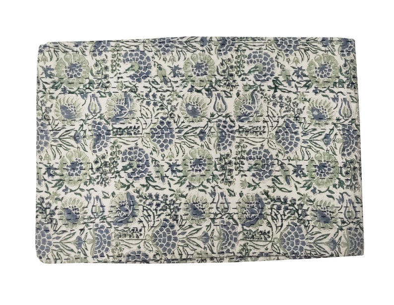 May include: A white kantha quilt with a floral pattern in shades of blue and green. The quilt is made of cotton and has a hand-stitched design.