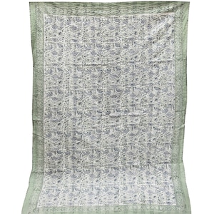 May include: A green and white kantha quilt with a floral pattern. The quilt has a border of green fabric with a white pattern.