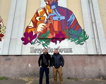 Ukranian Voluntary Soldiers.By the heros Wall.And to help raise funds for the volunteers we are printing their photos .