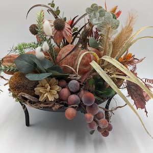 Autumn arrangement pumpkin coneflower grape orange