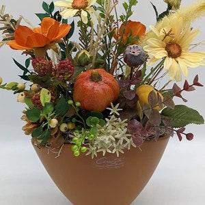 Autumn arrangement autumn decoration pumpkin daisies berries grasses orange brown