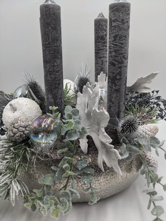 Modern Christmas arrangement with candles, baubles, apple, thistle, silver-grey