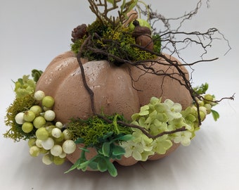 Autumn arrangement pumpkin acorn branches green