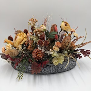Autumn arrangement cones carnation foliage orange