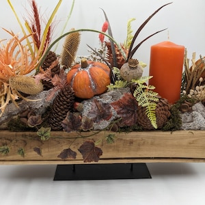 Autumn arrangement candle pumpkin cones leaves orange