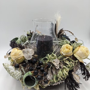 Autumn arrangement hurricane candle cones spring rose black