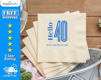 May include: A stack of beige paper napkins with blue text that reads "Hello 40 - Happy Birthday Jake".