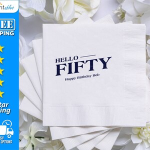 May include: White paper napkins with blue text that reads "HELLO FIFTY Happy Birthday Bob".