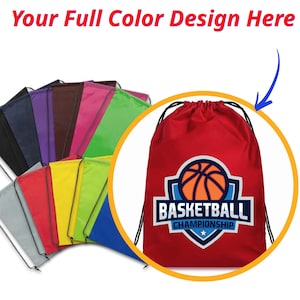 May include: A red drawstring bag with a basketball logo that says "Basketball Championship". The bag is shown with a variety of other drawstring bags in different colors.