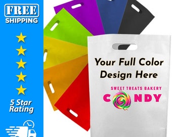 May include: A white reusable shopping bag with a die-cut handle. The bag has a colorful candy design and the text "Sweet Treats Bakery" and "Candy". The bag is shown with a variety of other reusable shopping bags in different colors.