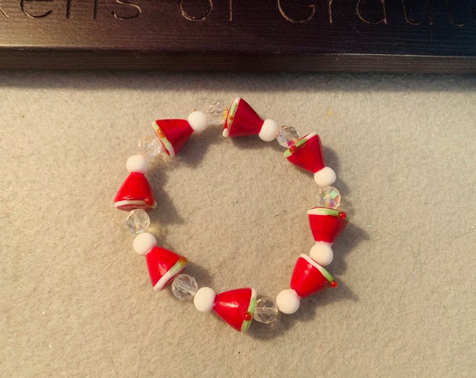 Santa hat beaded stretch bracelet with Santa hat glass beads. Ready to ship!