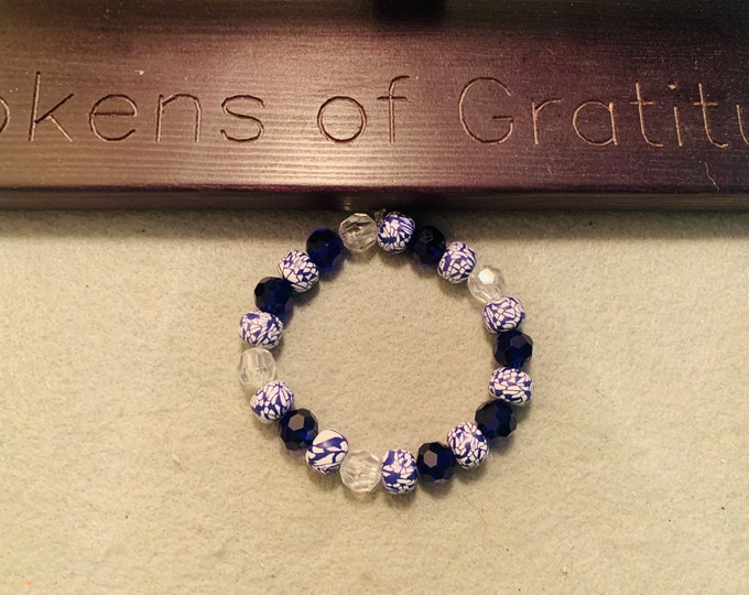 Royal Blue Sparkly beaded stretch bracelet with off setting blue and white beads