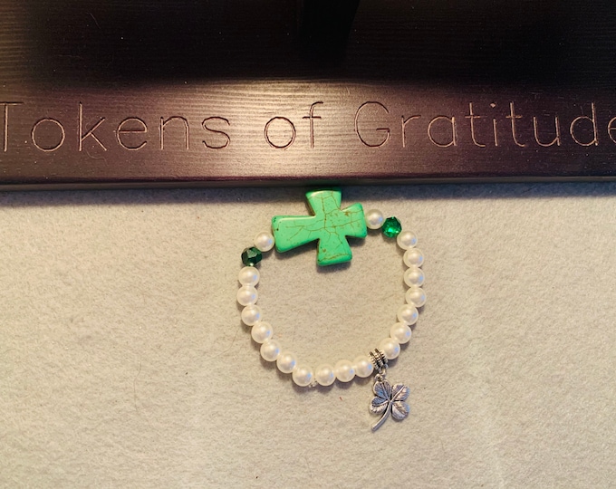 St Patricks Day beaded cross bracelet with clover charm