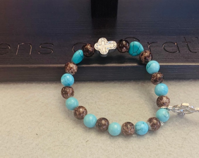 Turquoise and brown beaded bracelet with cross charm