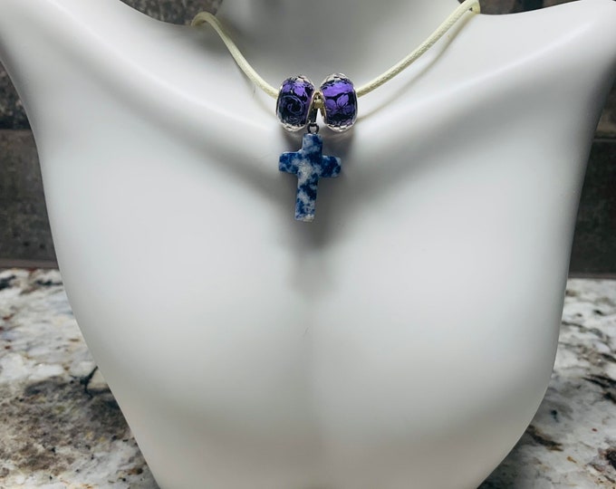 Purple cross necklace with purple glass spacer beads