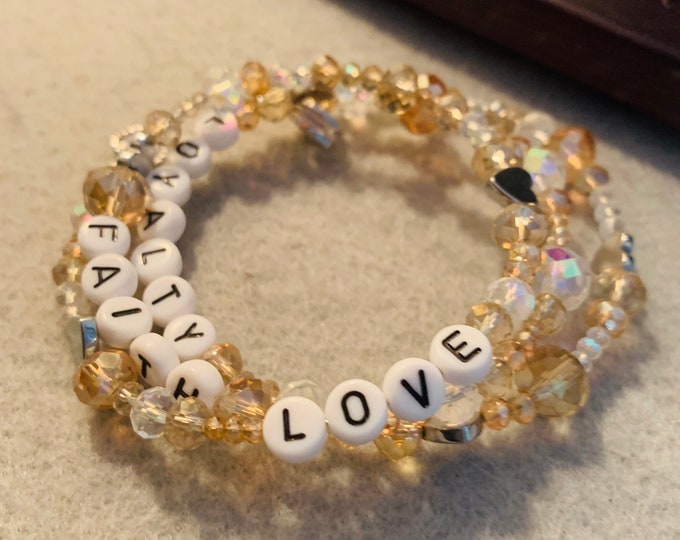 Personalized champagne colored metal wrap bracelet with white letter beads (customer chooses three words)