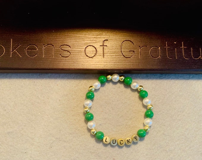 St Patricks Beaded Bracelet with “lucky” written in gold letters