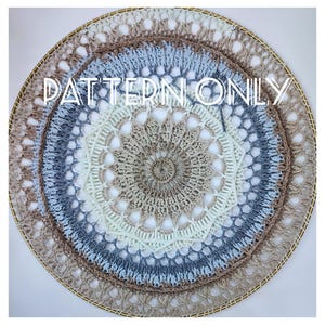 May include: A crocheted mandala wall hanging with a beige, white, and blue color scheme. The mandala is framed in a gold hoop. The text "PATTERN ONLY" is printed on the image.