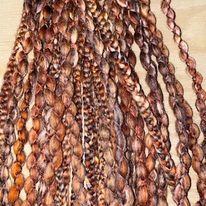 Fancy brown double ended and single ended wool dreadlock extensions