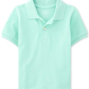 May include: A light green polo shirt with short sleeves. The shirt has a collared neckline and a three-button placket. The brand name "PLACE" is visible on the collar. The shirt is made of a soft, breathable fabric.
