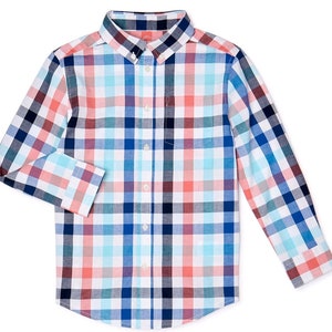 May include: A long-sleeved button-down shirt with a plaid pattern in shades of white, blue, red, and teal. The shirt has a button-down collar and a chest pocket. The Wonder Nation logo is visible on the collar.
