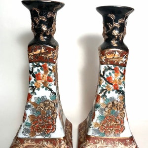 A pair of beautiful vintage porcelain candlestick holder hand painted Chinese decorated with flowers