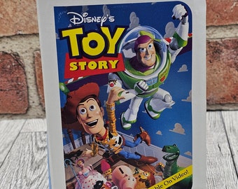 Toy Story Woody Toy in Disney VHS Movie Box style box 1996 Woody is in original box McDonalds Happy Meal Toy