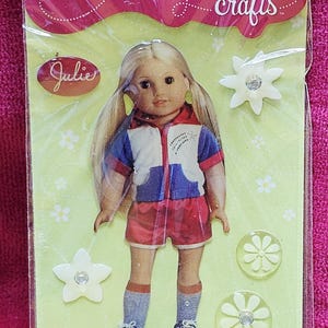 May include: Package of American Girl crafts bubble stickers featuring a doll named Julie and star and flower-shaped stickers. The package includes six pieces and is suitable for ages 8 and up.