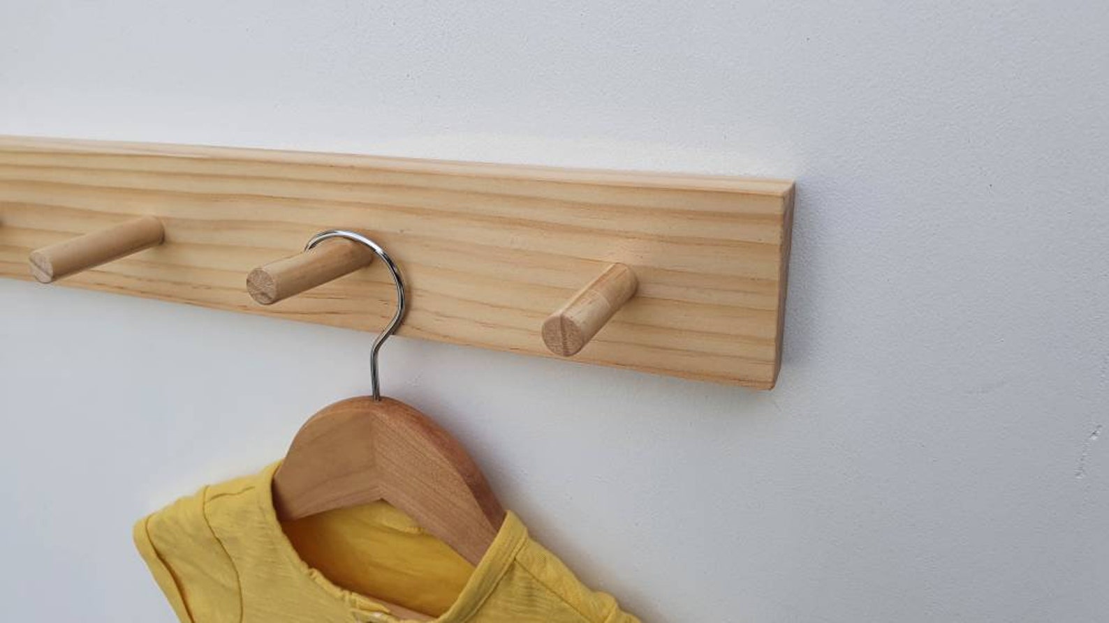 wooden coat peg rail