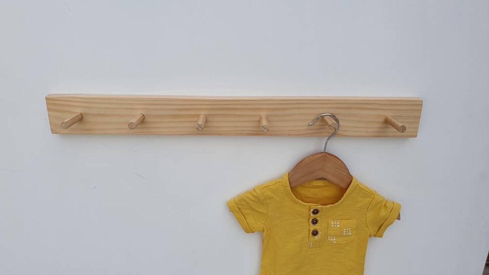wooden coat peg rail