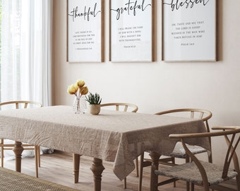 May include: Three framed wall art prints with white backgrounds and black text. The prints feature the words thankful, grateful, and blessed in script font, accompanied by Bible verses from 1 Thessalonians 5:18, Psalm 69:30, and Psalm 34:8.