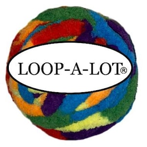 May include: A colorful, round toy with the text "LOOP-A-LOT" in a white oval. The toy features a mix of vibrant colors, including red, blue, green, yellow, orange, and purple, creating a playful and engaging appearance.
