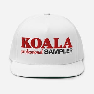 May include: White baseball cap with black and red embroidered text that reads "KOALA professional SAMPLER".