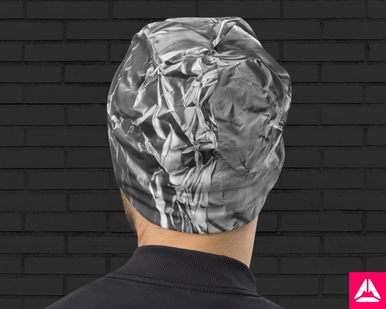 May include: A silver beanie with a crinkled, textured design. The beanie is made of a soft, stretchy material and is perfect for keeping your head warm in the winter.