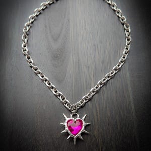 Pink spiiked heart pendant necklace