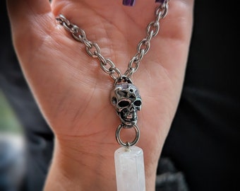 Crystal quartz point pendant necklace with skull detail