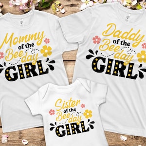 May include: Three white t-shirts with black and yellow text that reads "Mommy of the Bee Day Girl", "Daddy of the Bee Day Girl", and "Sister of the Bee Day Girl".