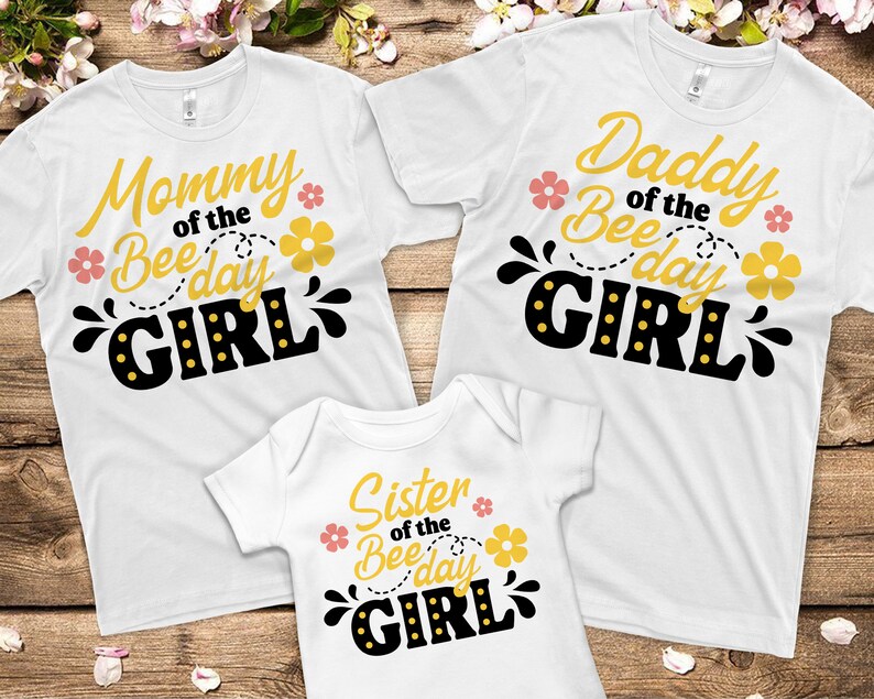May include: Three white t-shirts with black and yellow text that reads "Mommy of the Bee Day Girl", "Daddy of the Bee Day Girl", and "Sister of the Bee Day Girl".