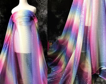 May include: Rainbow iridescent sequin mesh fabric with a gradient of pink, purple, blue, green, and yellow. The fabric is sheer and has a delicate texture.