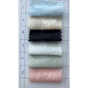 May include: A swatch card with fabric samples in various colors and textures. The swatches are labeled with numbers 1, 2, 4, 7, 10, and 5.