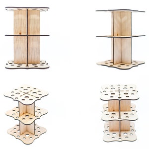 May include: A three-tiered wooden stand with a decorative, scalloped edge and multiple holes for holding items. The stand is made of light-colored wood and is perfect for organizing and displaying small items.