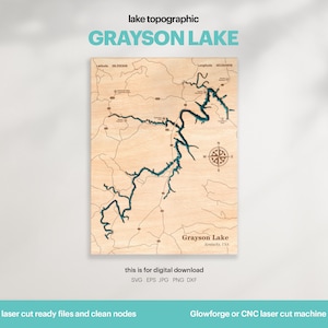 May include: A laser-cut wooden map of Grayson Lake, Kentucky. The lake is outlined in blue and the surrounding area is shown in brown. The map includes a compass rose and the text "Grayson Lake, Kentucky, USA".