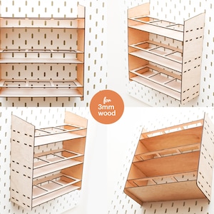 May include: A wooden shelf unit with four shelves and multiple compartments on each shelf. The shelf unit is designed for 3mm wood.