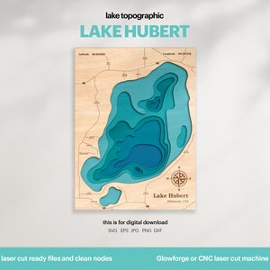 May include: A laser cut wooden map of Lake Hubert in Minnesota. The map is layered with different shades of blue to show the depth of the lake. The map includes a compass and the text "Lake Hubert, Minnesota, USA".
