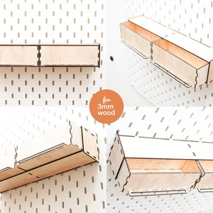 May include: Two sets of wooden shelves with three compartments each. The shelves are designed to be mounted on a pegboard wall. The shelves are made of 3mm wood.