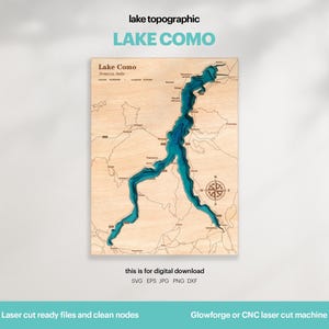 May include: A wooden topographic map of Lake Como, Italy, with blue water and detailed land features. The text "LAKE COMO" is at the top. Includes the text "this is for digital download" and "Laser cut ready files and clean nodes".